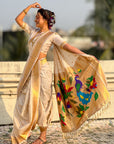Cream Nauvari Pathani Silk Zari Woven Muniya Border Saree