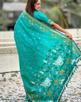 Aqua Blue Soft Zari Woven Lotus Border and Pichwai Art Pallu Silk Saree