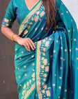 Peacock Blue Soft Zari Woven Lotus Border and Pichwai Art Pallu Silk Saree