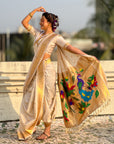 Cream Nauvari Pathani Silk Zari Woven Muniya Border Saree