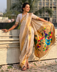 Cream Nauvari Pathani Silk Zari Woven Muniya Border Saree