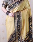 Chikoo Soft Warli Art Zari Woven Silk Saree with Contrast Border