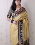 Chikoo Soft Warli Art Zari Woven Silk Saree with Contrast Border