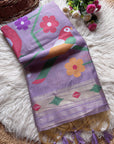 Colorful towel with floral and bird design on a textured surface