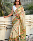 Woman wearing a floral saree with a blurred background