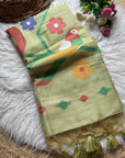 Colorful scarf with floral patterns and tassels on a textured surface