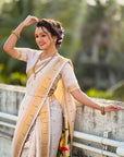 Cream Nauvari Pathani Silk Zari Woven Muniya Border Saree