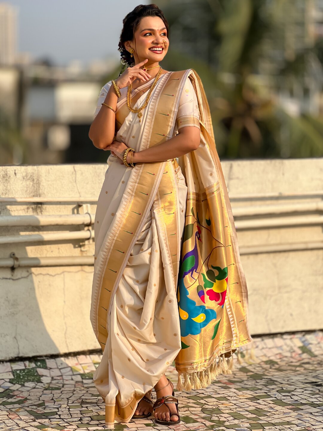 Cream Nauvari Pathani Silk Zari Woven Muniya Border Saree