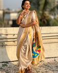 Cream Nauvari Pathani Silk Zari Woven Muniya Border Saree