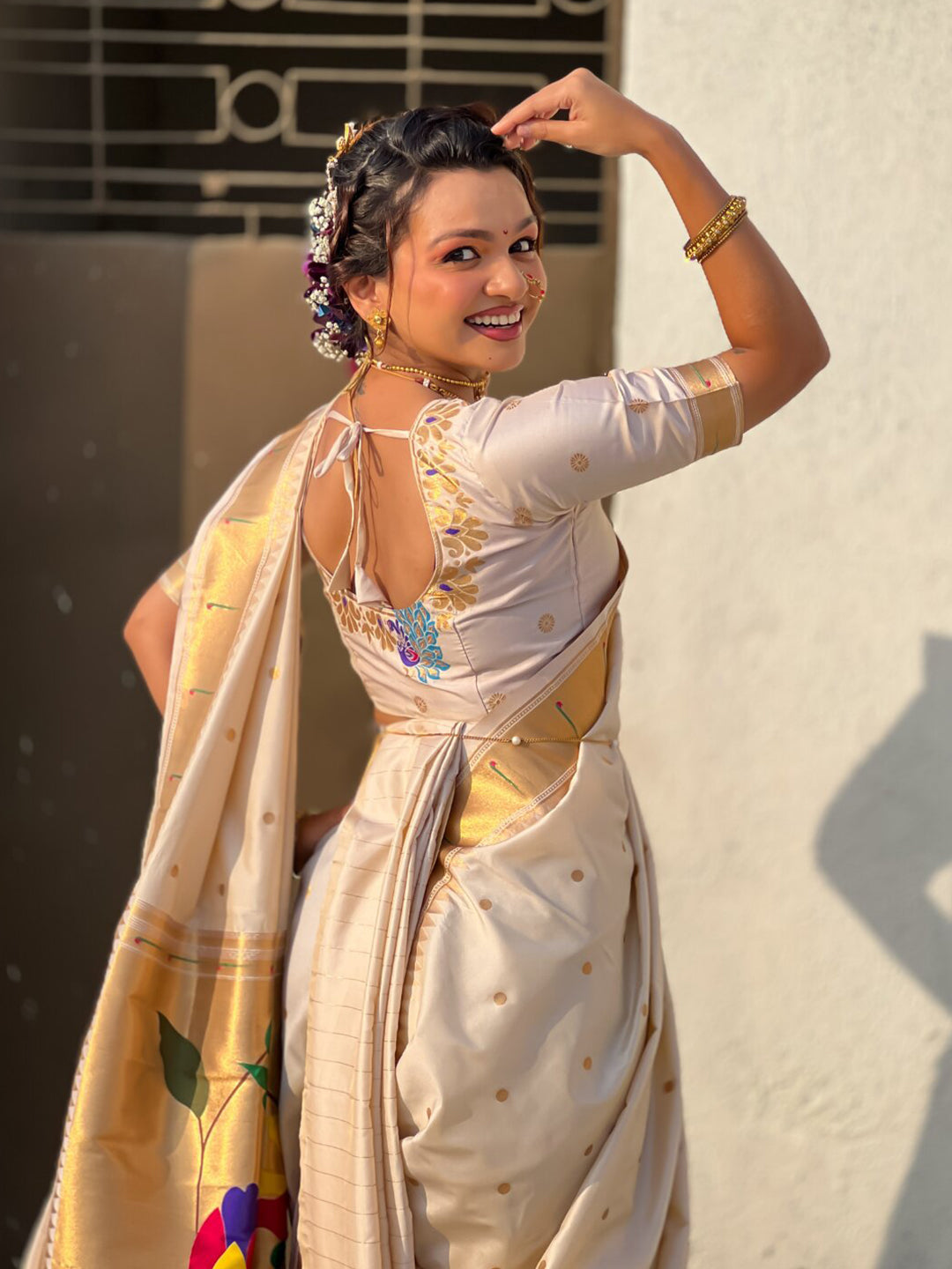 Cream Nauvari Pathani Silk Zari Woven Muniya Border Saree