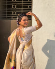 Cream Nauvari Pathani Silk Zari Woven Muniya Border Saree