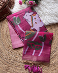 Two pink scarves with animal designs on a textured surface.