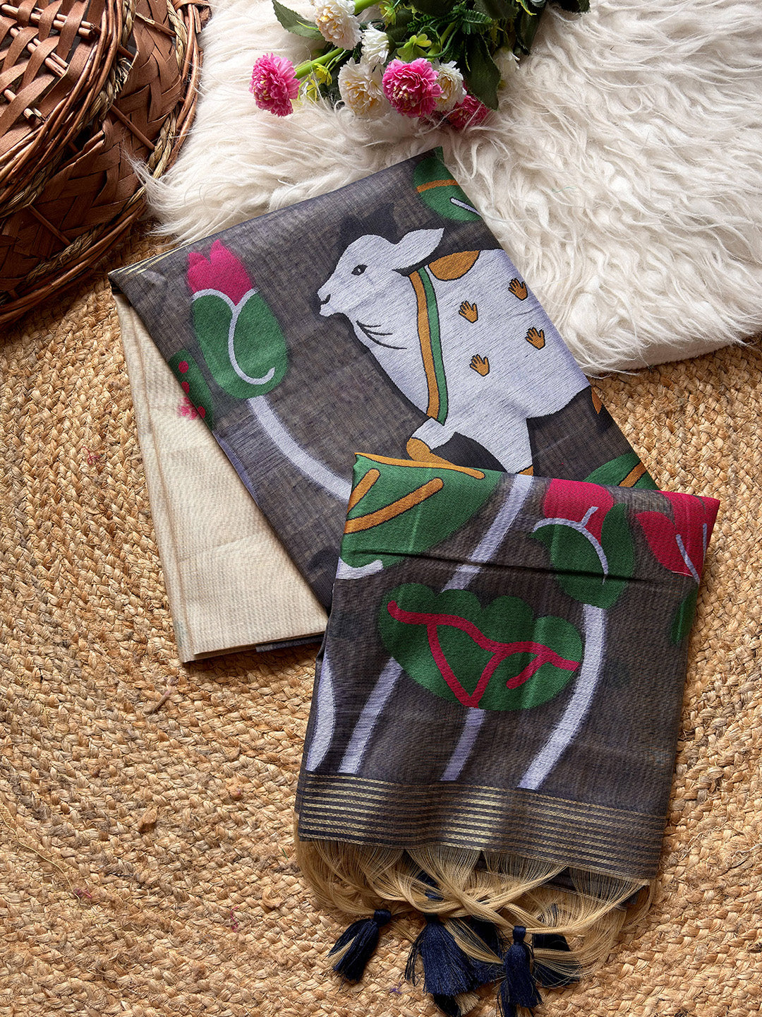 Decorative scarf with a goat design on a textured surface