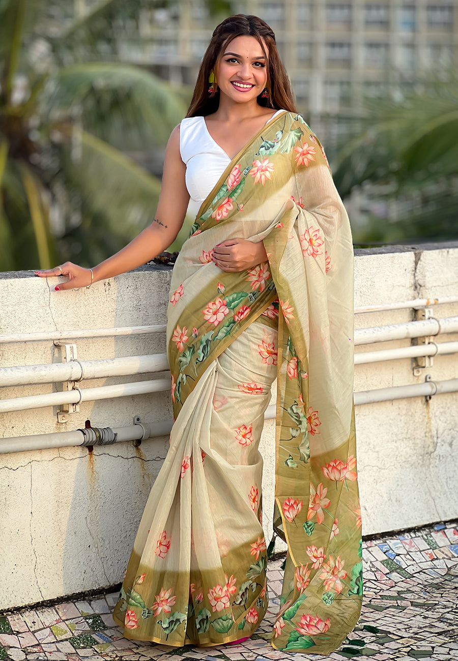 Woman wearing a floral saree with a blurred background