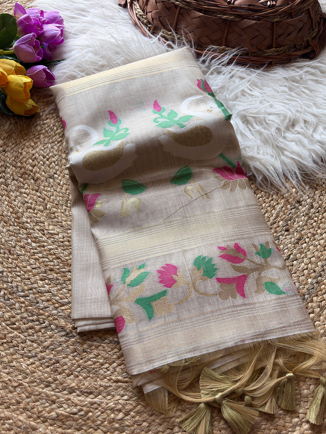 Beige fabric with floral patterns on a textured surface