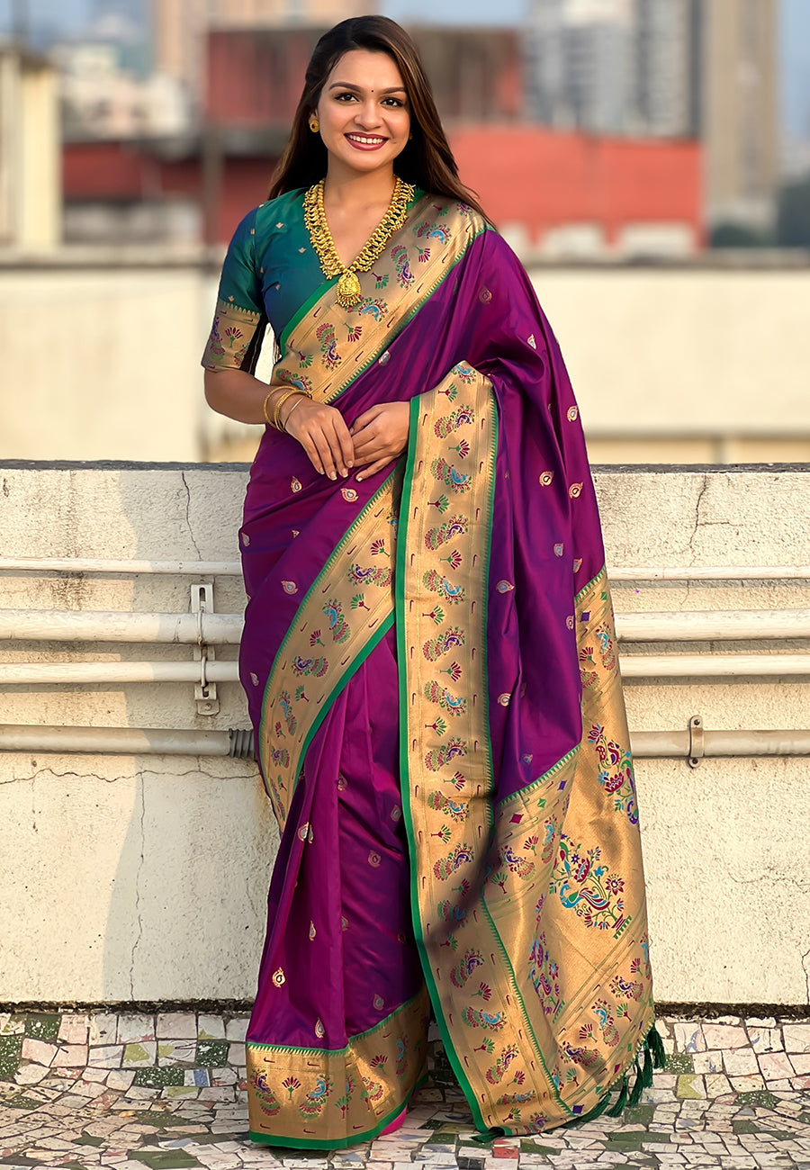 Woman wearing a traditional saree with a cityscape in the background