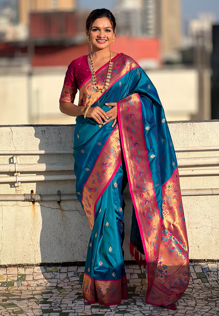 Woman wearing a traditional saree with a cityscape background